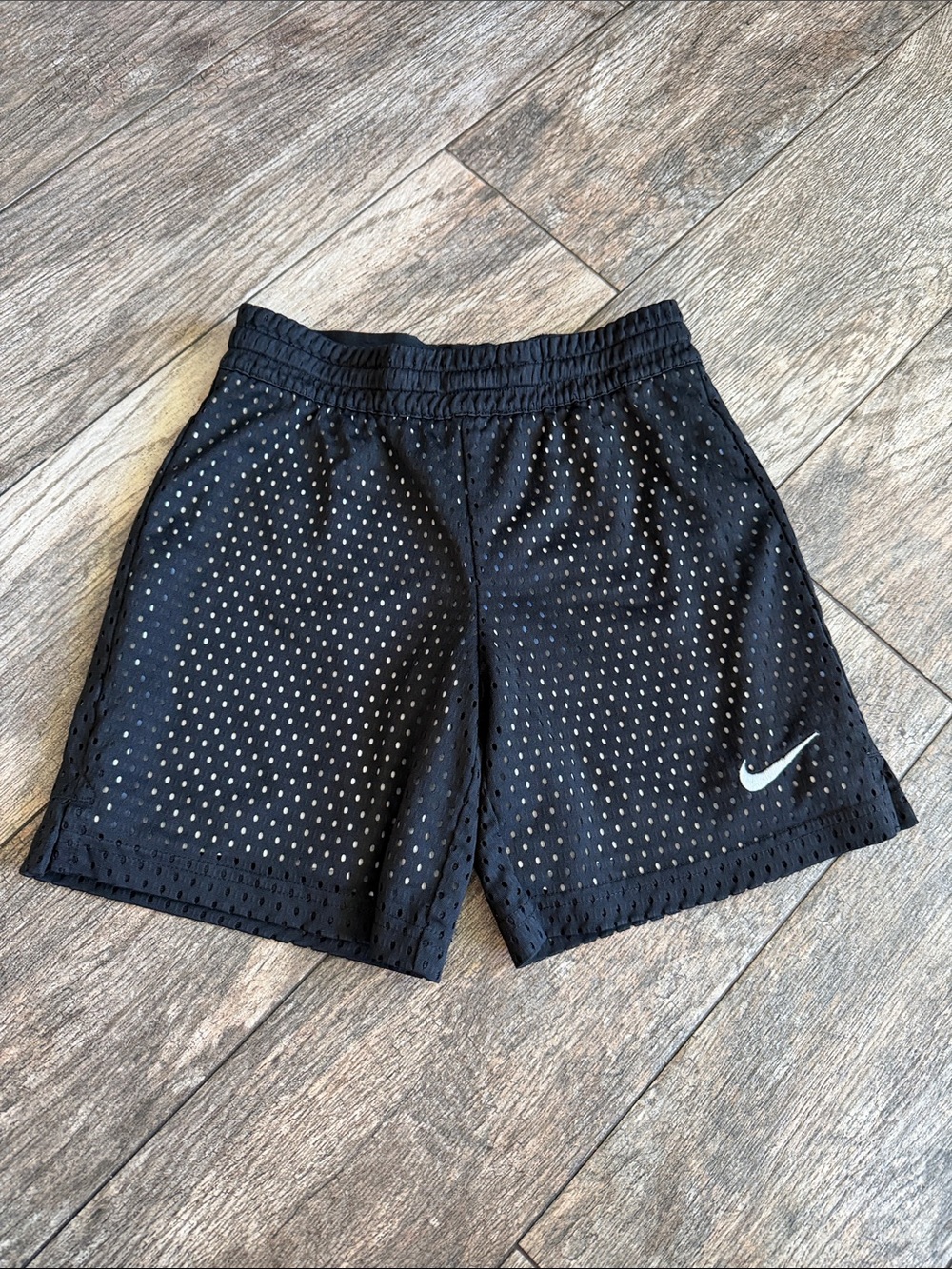 Nike Men's Black Perforated Athletic Shorts with White Swoosh